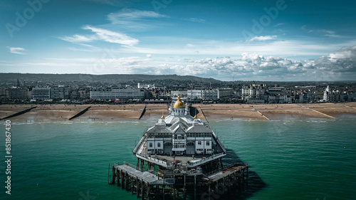 Aerial view of a Eastbourne pier on a cold but clear day with caml waters surrounging it, Eastbourne, East Sussex, UK photo