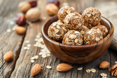 energy balls of nuts oats and dates in bowl, selective focus