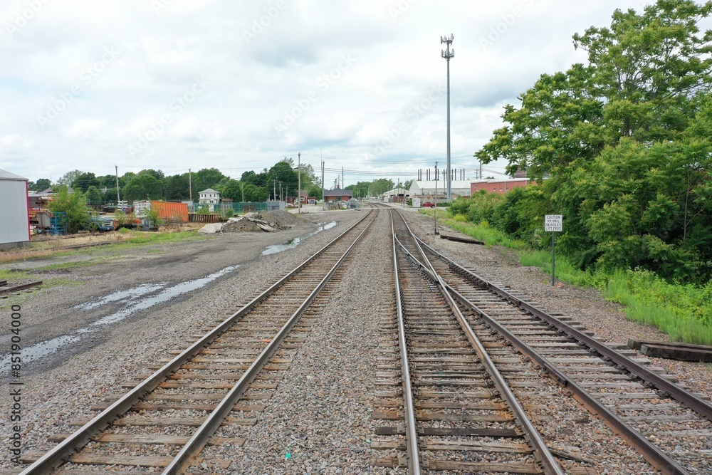 Midwestern train tracks leading to train station Midwestern train tracks leading to train station