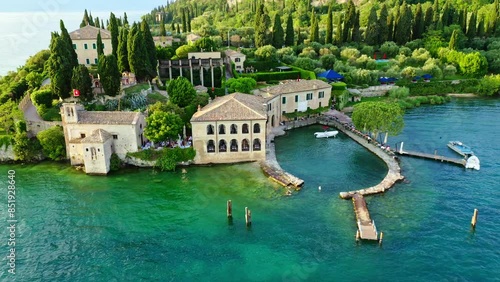 Punta San Vigilio Lake Garda Aerial View with Blue Water and Shoreline, Idyllic Summer Vacation Destination, Clear Sky and Historic Peninsula Background