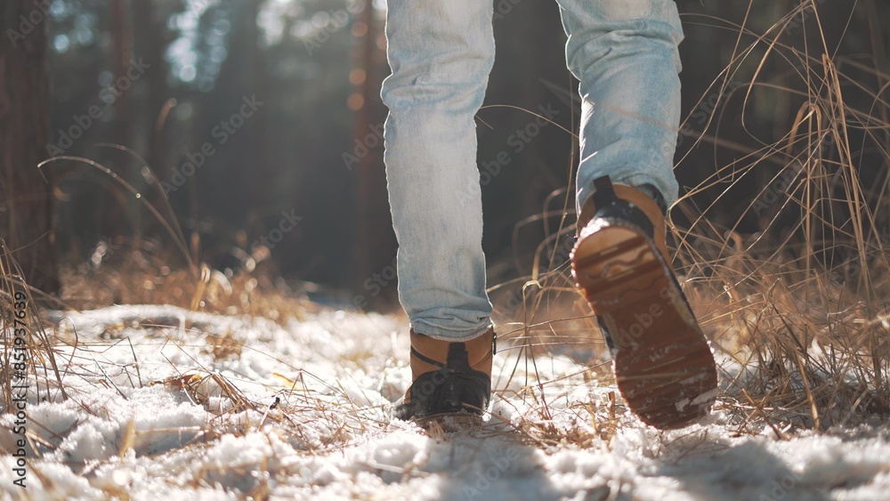 Tourist feet in snow, embodying freedom with every winter forest walk. journey of solitude and freedom in snow covered woods. Walk in winter forest, step toward freedom in nature silence. leg close up Tourist feet in snow, embodying freedom with every winter forest walk. journey of solitude and freedom in snow covered woods. Walk in winter forest, step toward freedom in nature silence. leg close up