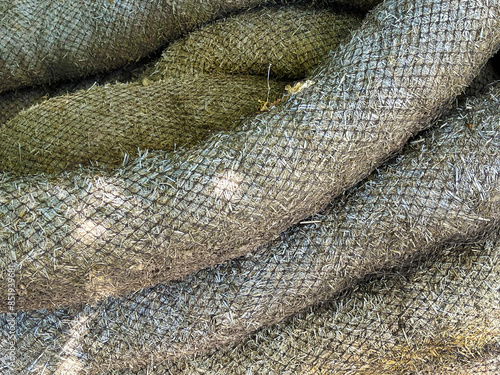 Φωτογραφία Pile of Landscaping Rice Straw Wattles