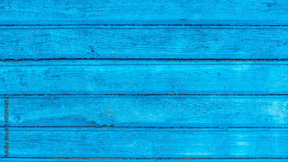 The empty wooden background is blue. Straight lines at different angles, backlight and light gradient. Layout for design or advertising The empty wooden background is blue. Straight lines at different angles, backlight and light gradient. Layout for design or advertising
