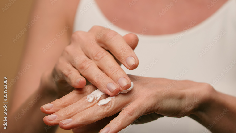 Close up female wrinkled hands mature old woman applying moisturizing cream natural beauty anti-aging skincare cosmetics lifting body lotion soft moisturize daily treatment dry skin palms cosmetology Close up female wrinkled hands mature old woman applying moisturizing cream natural beauty anti-aging skincare cosmetics lifting body lotion soft moisturize daily treatment dry skin palms cosmetology