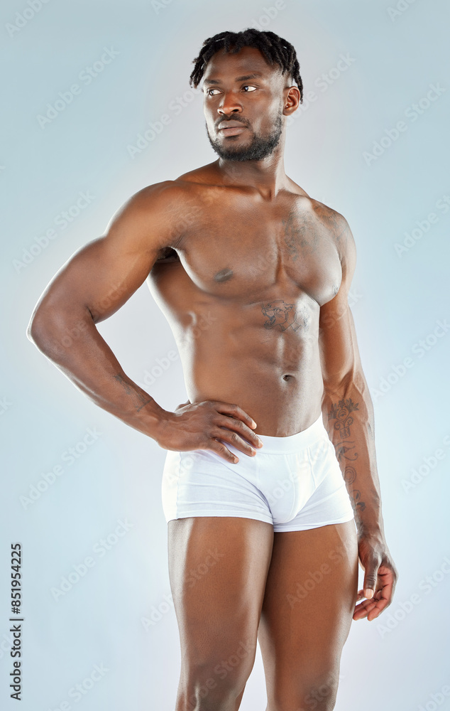 Fototapeta premium Black man, fitness and thinking in studio for body, exercise and wellness in underwear. Athlete, sports and idea for training, detox and bodybuilder with pride or confidence by white background