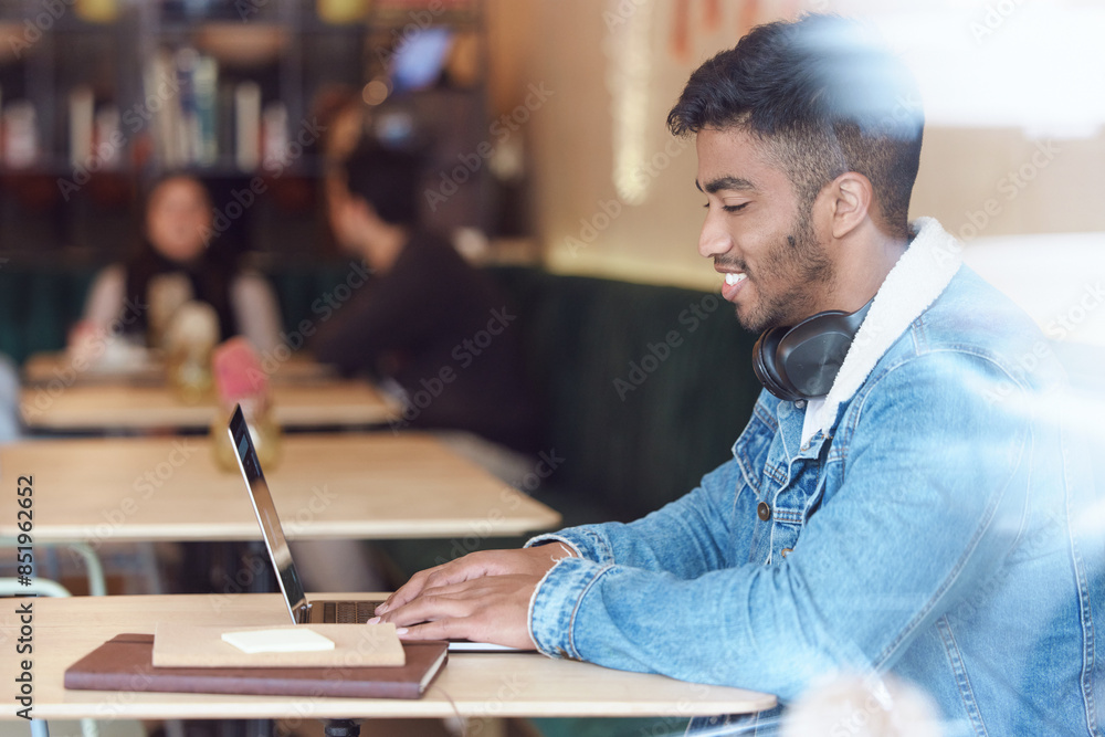 Fototapeta premium Man, happy and cafe or typing on laptop for remote work, freelancer and report or searching on internet for information. Network, communication and blog online with copywriter, restaurant and smiling