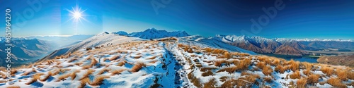 New Zealand Panorama. Hiking Trail to Roys Peak Summit near Wanaka with Snow-Capped Hills & Lake View photo