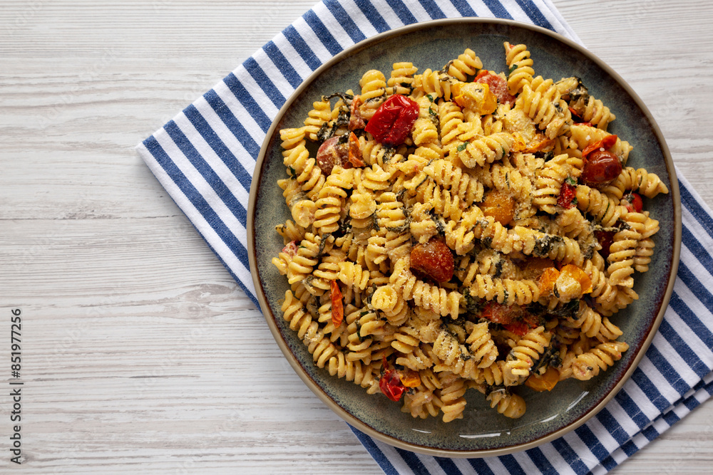 Homemade Baked Boursin Pasta on a Plate, top view. Flat lay, overhead, from above. Homemade Baked Boursin Pasta on a Plate, top view. Flat lay, overhead, from above.