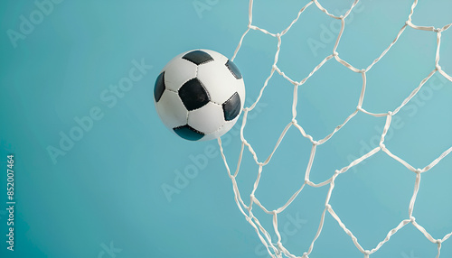 Football socer ball on football play, flying ball net over blue background with copy space, goal concept