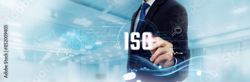 ISO: Analyzing Business Graph and Data of ISO Certified Business Growth, Quality Management. Businessman Touching and Analyzing Data Growth of ISO Standards, Efficiency, Excellence, Compliance.