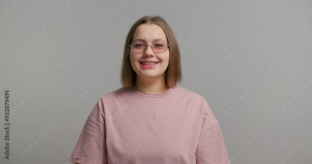 Image of happy smiling young blond plus size woman posing isolated over grey wall background Image of happy smiling young blond plus size woman posing isolated over grey wall background