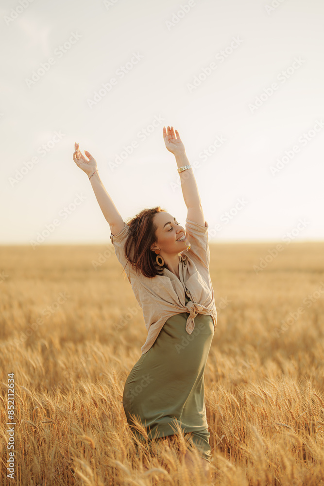 An exuberant woman raises her arms in celebration amidst a vast, sunlit wheat field, conveying a sense of freedom and happiness. An exuberant woman raises her arms in celebration amidst a vast, sunlit wheat field, conveying a sense of freedom and happiness.
