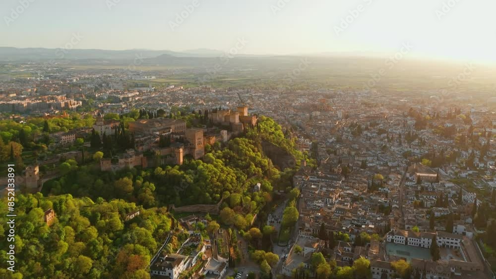 Aerial view of the Alhambra palace at sunset in Granada, Andalusia, Spain Aerial view of the Alhambra palace at sunset in Granada, Andalusia, Spain