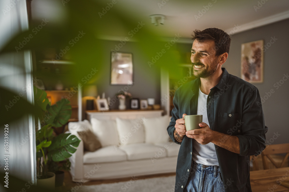 Portrait of adult handsome man drink first coffee in the living room Portrait of adult handsome man drink first coffee in the living room