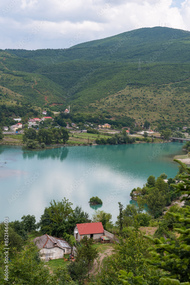Fototapeta premium Village near lake Komoni in the countryside of North Albania