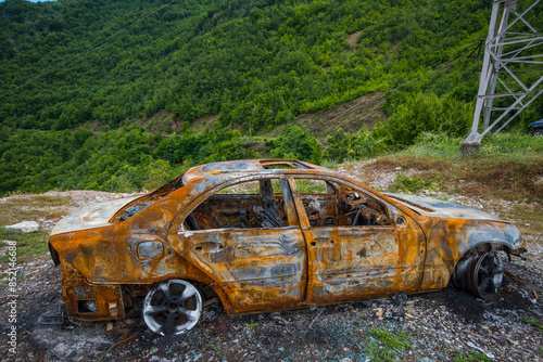 Burned down car in the mountains of North Albania