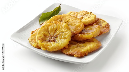 A plate of Dominican food consisting of fried plantains isolated on a white background
