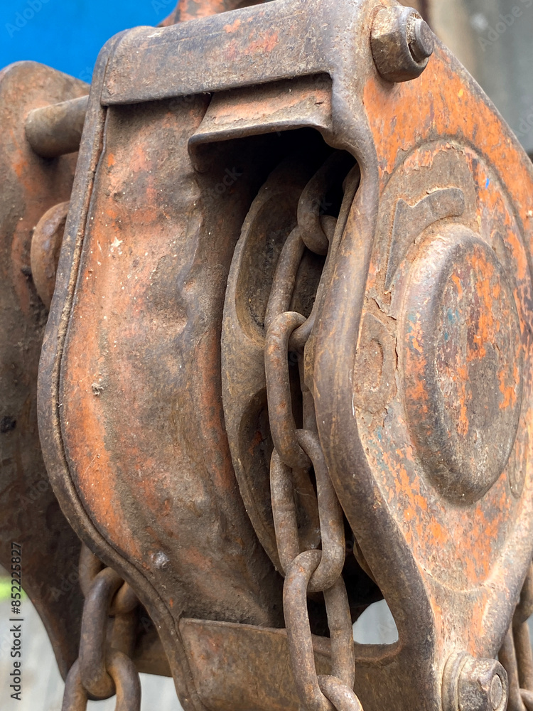 old rusty metal reel and chain old rusty metal reel and chain