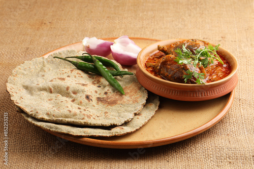 Multigrain Roti or millet flat bread.Made with chana ,caun, green moong , udad ,ragi , Jowar farmer's lunch Indian bread with Brinjal curry