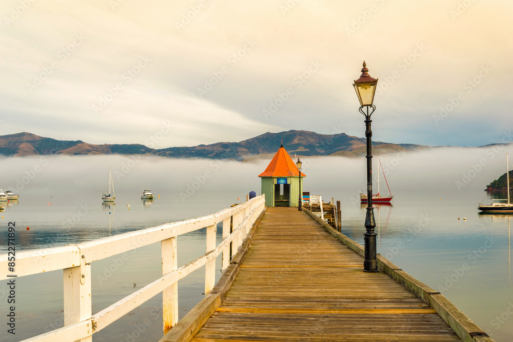 Wooden Wharf at Akaroa Beach on the Banks Peninsula, southeast of Christchurch, South Island, New Zealand