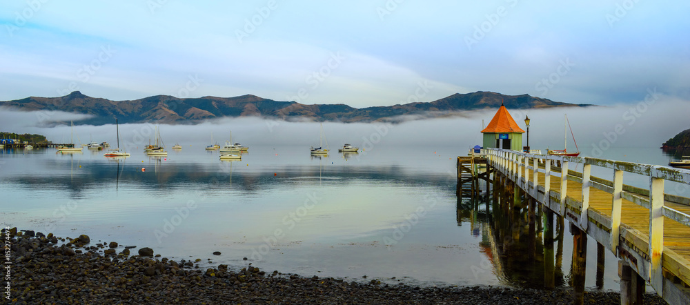 Landscape Scenery of Akaroa Harbour, New Zealand in the Morning Misty Day