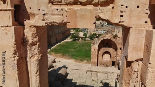 A shot of the ancient archaeological wonder Roman ruins at Baalbek, a UNESCO World Heritage site in Lebanon's Bekaa Valley. Towering columns, intricate stonework.