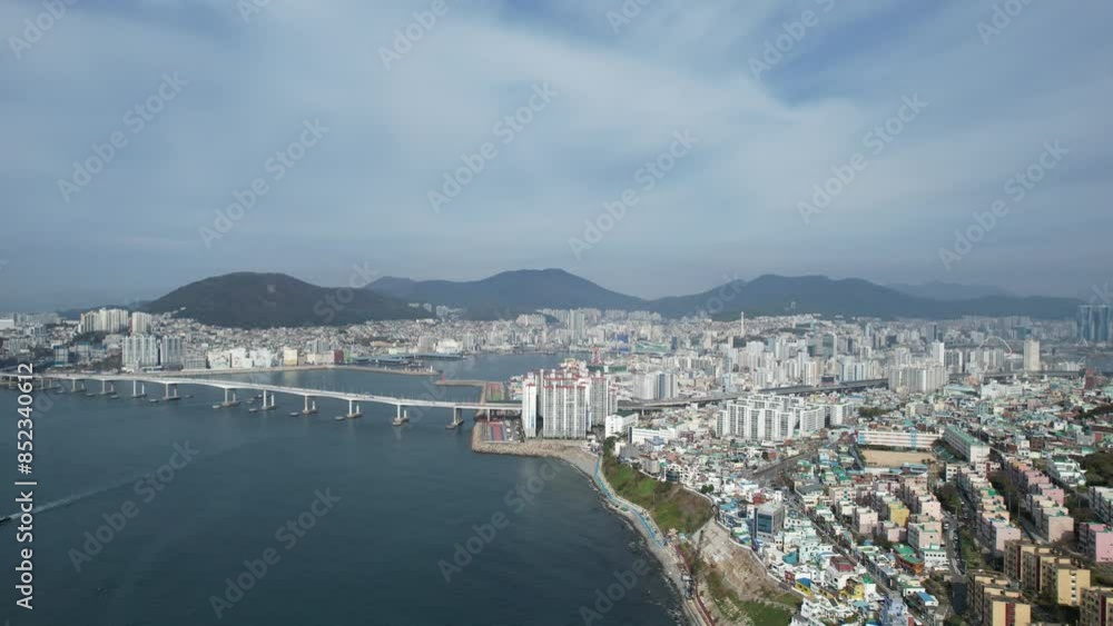 aerial view of Huinnyeoul Culture Village in Busan, Korea. The picture showcases a coastal village with a terraced landscape, colorful buildings, and a beautiful seafront. aerial view of Huinnyeoul Culture Village in Busan, Korea. The picture showcases a coastal village with a terraced landscape, colorful buildings, and a beautiful seafront.