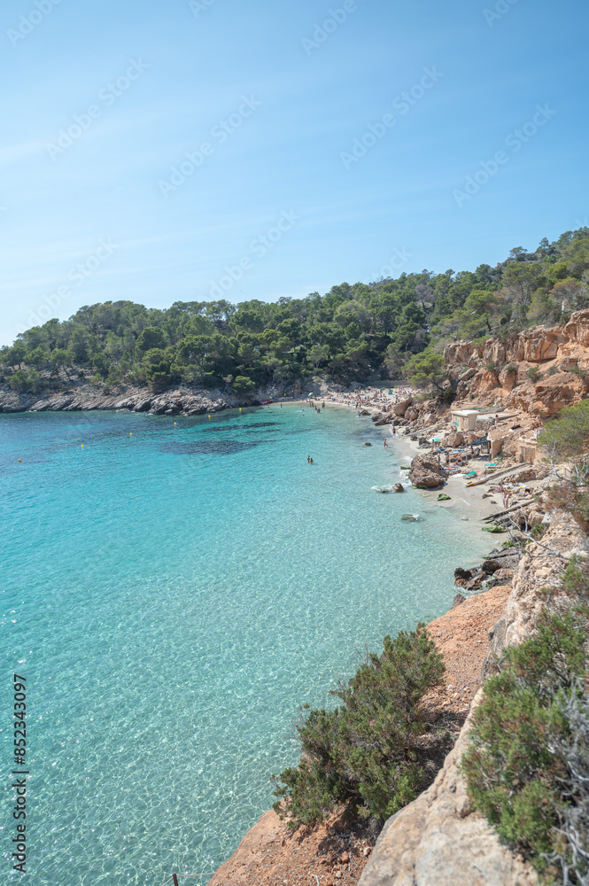Turquoise waters of Cala Saladeta in Ibiza in summer