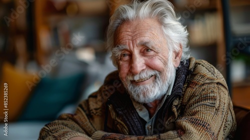 portrait of a smiling, cheerful Caucasian elderly man 70-79 years old looking at the camera at home © Photolife  