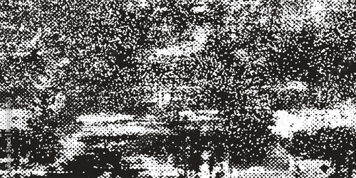 Distressed background in black and white texture with dots, spots, scratches and lines. Abstract vector illustration