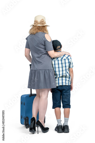 Family, mom in sunglasses and hat stands with son with blue suitcase, isolated on white background. Full length, rear view