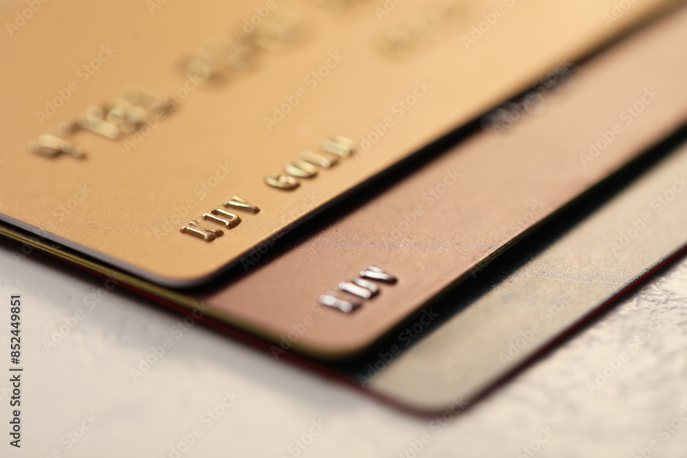 Many credit cards on gray background, closeup Many credit cards on gray background, closeup