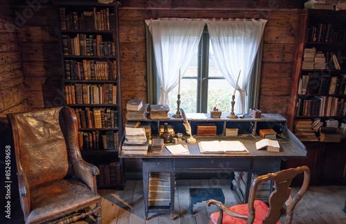 Obraz na płótnie Interior of old library with vintage furniture, chair, table and books w salonie