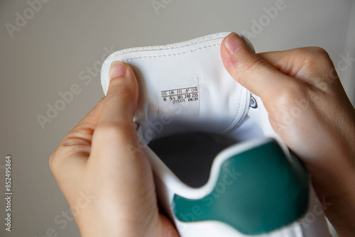 Shoes size label on tongue of the sneaker