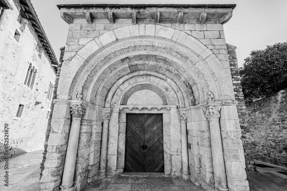 Besalú, Catalonia, Spain: Saint Julian church hospital, original 12th century facade in black and white Besalú, Catalonia, Spain: Saint Julian church hospital, original 12th century facade in black and white