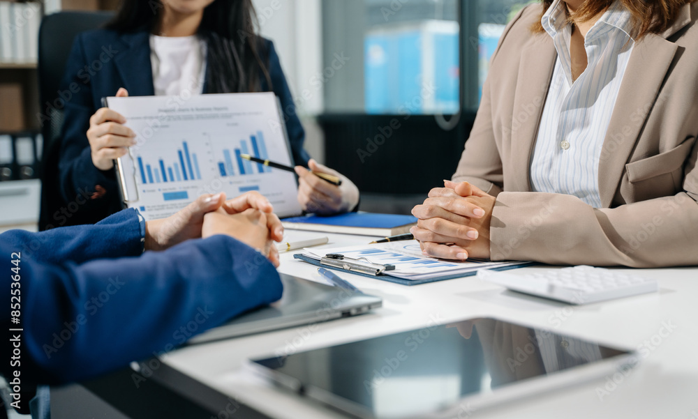 Businessman and team analyzing financial statement Finance task. with smart phone and laptop and tablet. Businessman and team analyzing financial statement Finance task. with smart phone and laptop and tablet.