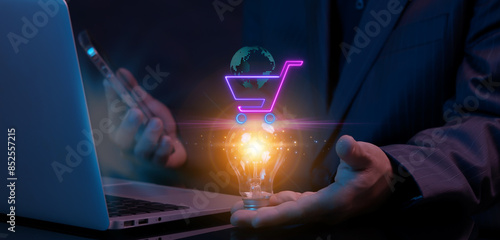 Wallpaper Mural Procurement Management Industry for supply chain and retail logistics concept. Businessman showing glowing lightbulb with neon line of shopping cart with world sign. Torontodigital.ca