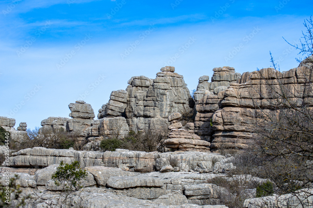 Hiking in the Torcal de Antequerra National Park, limestone rock formations and known for unusual karst landforms in Andalusia, Malaga, Spain. Hiking in the Torcal de Antequerra National Park, limestone rock formations and known for unusual karst landforms in Andalusia, Malaga, Spain.