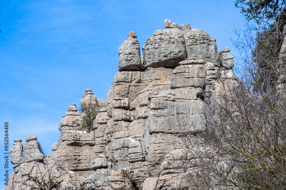 Hiking in the Torcal de Antequerra National Park, limestone rock formations and known for unusual karst landforms in Andalusia, Malaga, Spain.