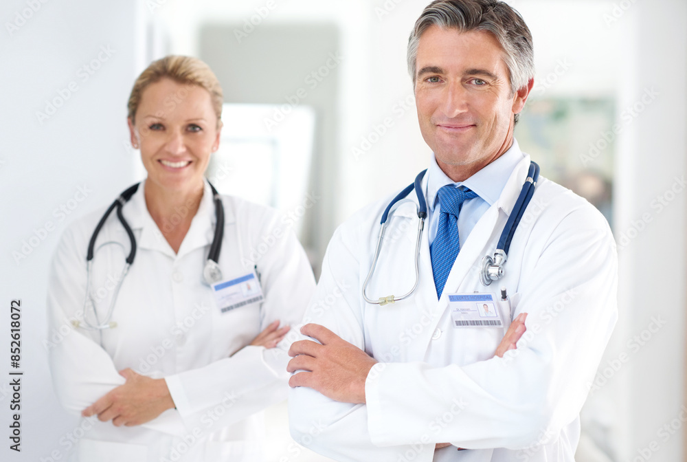 Portrait, medical team and happy in lobby for healthcare, professional and pride in hospital. Mature doctors, support and about us in corridor for cardiology, medicare and expertise in clinic Portrait, medical team and happy in lobby for healthcare, professional and pride in hospital. Mature doctors, support and about us in corridor for cardiology, medicare and expertise in clinic
