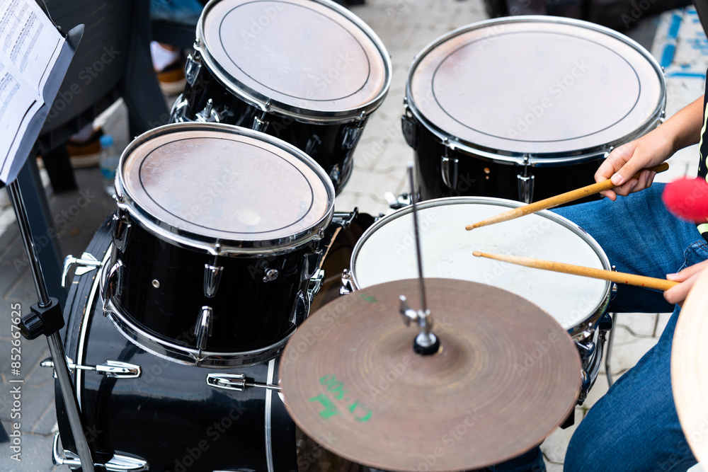 Female musician percussionist playing drums Female musician percussionist playing drums