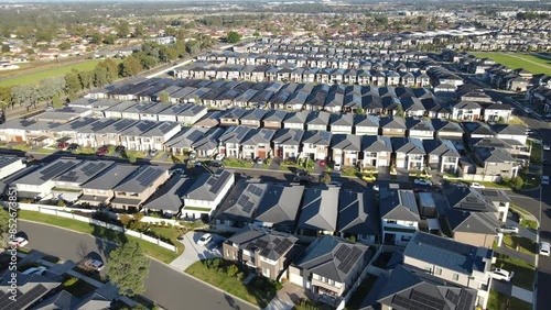 Aerial drone view of The Ponds in the North West of Sydney, NSW Australia on a sunny morning in June 2024 showing the densely packed homes and housing density  photo