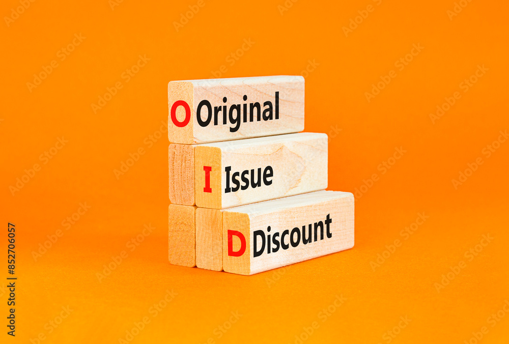 Naklejka premium OID original issue discount symbol. Concept words OID original issue discount on beautiful wooden blocks. Beautiful orange background. Business OID original issue discount concept. Copy space.