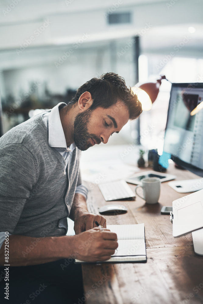 © Delmaine/peopleimages.com - Man, writing and notebook in office for notes, planning and schedule for strategy or logistics. Male person, journal and information on project or proposal, employee and ideas in diary for admin © Delmaine/peopleimages.com - Man, writing and notebook in office for notes, planning and schedule for strategy or logistics. Male person, journal and information on project or proposal, employee and ideas in diary for admin
