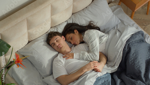 Slika na platnu Couple love man woman sleep on bed bedroom home cosy wake up together happiness