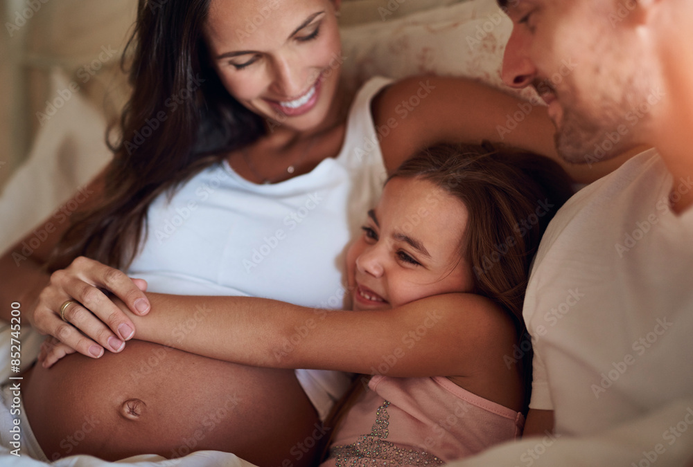 Child, happy family and pregnancy on bed with hug, support and daughter in morning. Parents, girl and love in bedroom for growth, safety and security at home with happiness, smile and excitement Child, happy family and pregnancy on bed with hug, support and daughter in morning. Parents, girl and love in bedroom for growth, safety and security at home with happiness, smile and excitement