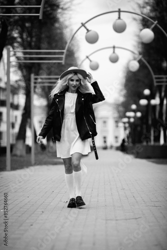 Portrait of a young beautiful blonde girl in black and white style.