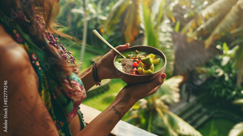 Beautiful woman eating a smoothie bowl in Bali