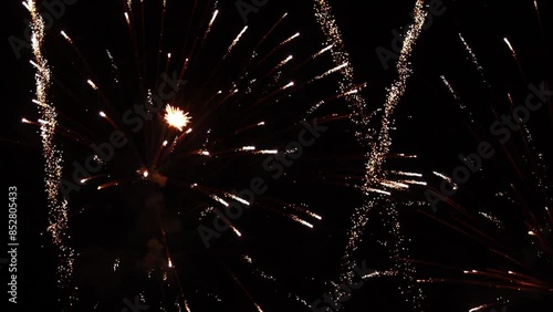 Festive fireworks in night sky of big city.