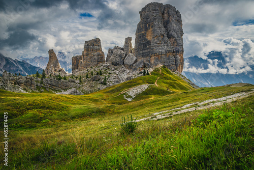 Green meadow and Cinque Torri rock formations, Dolomites photo